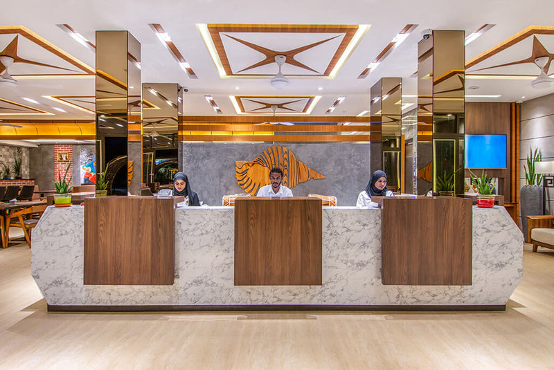 Reception desk in the lobby of Triton Prestige