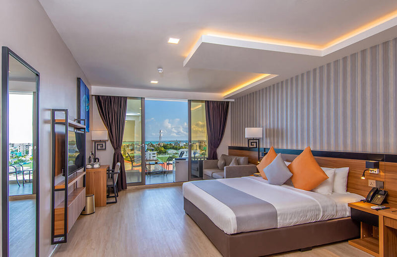 Large room at Triton Prestige with a king bed and seating area