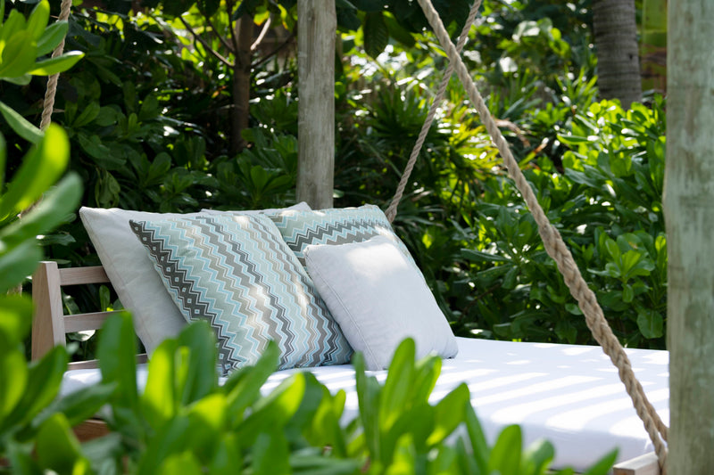 Waldorf Astoria Maldives Ithaafushi, South Malé Atoll: a swinging daybed among the greenery of a Beach Villa garden