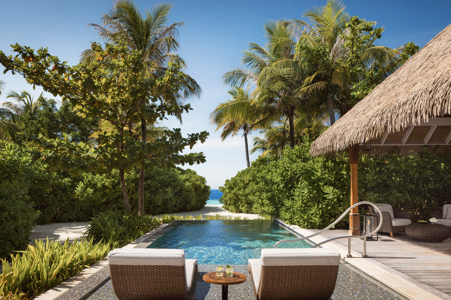 Waldorf Astoria Maldives Ithaafushi, South Malé Atoll: a Beach Villa's private pool and loungers, with a garden path to the sand
