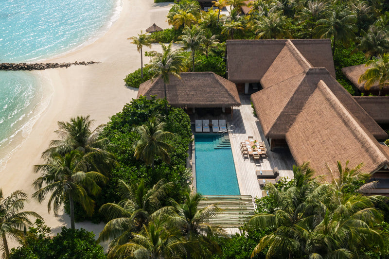 Waldorf Astoria Maldives Ithaafushi, South Malé Atoll: aerial view of a Two Bedroom Beach Villa with a long pool beside the sand