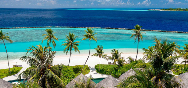 The beach and lagoon at The Nautilus Maldives from the air.