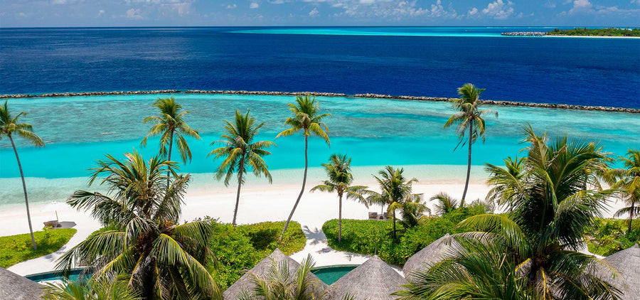 The beach and lagoon at The Nautilus Maldives from the air.