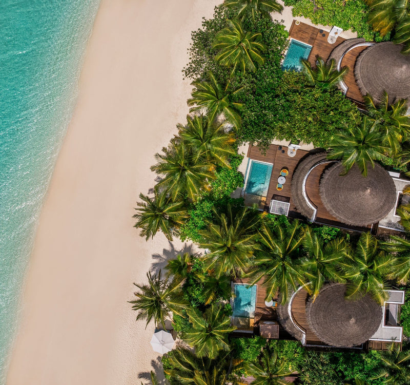 A beach villa at W Maldives seen from the air