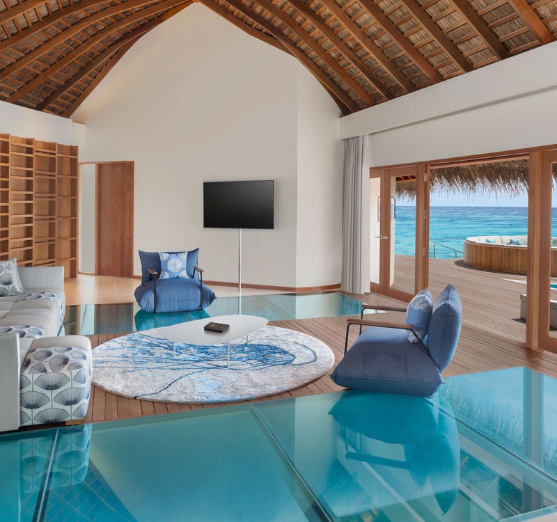 The living room of an Oasis Overwater Two-bedroom Villa at W Maldives