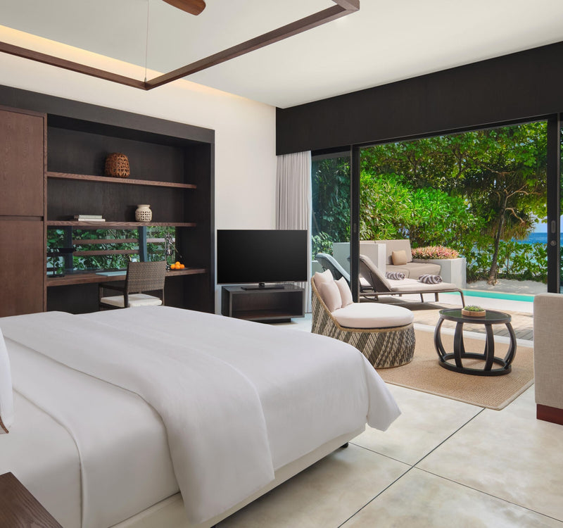 A Beach Villa bedroom at The Westin Maldives Miriandhoo Resort