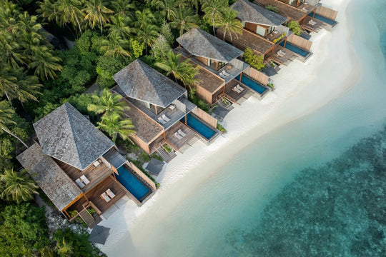 The St. Regis Maldives Vommuli, Dhaalu Atoll — Aerial along a curve of beach villas, each with its own pool