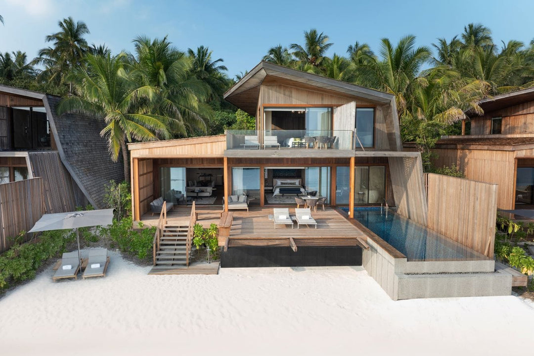 The St. Regis Maldives Vommuli, Dhaalu Atoll — Two-storey beach villa with a pool, seen from the sand