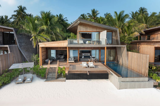 The St. Regis Maldives Vommuli, Dhaalu Atoll — Two-storey beach villa with a pool, seen from the sand