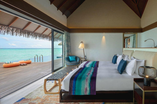 Pullman Maldives Maamutaa, Gaafu Alifu Atoll — two-bedroom villa interior with twin beds facing the pool