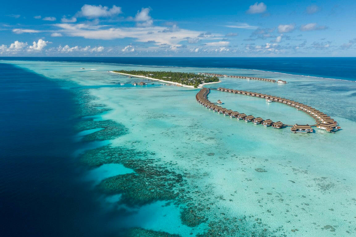 Pullman Maldives Maamutaa, Gaafu Alifu Atoll — overwater villa exterior above the house reef