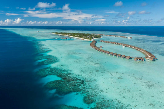 Pullman Maldives Maamutaa, Gaafu Alifu Atoll — overwater villa exterior above the house reef