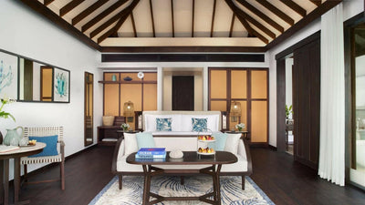 An Ocean Pool Villa at Anantara Veli, sitting area and writing desk beside the bed