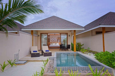 A Beach Pool Villa at Brennia Kottefaru, its private pool and loungers in a walled garden