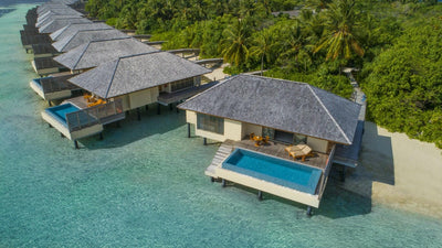 Deluxe Lagoon Pool Villas at The Residence Maldives at Dhigurah, each with a private pool on its deck above the water