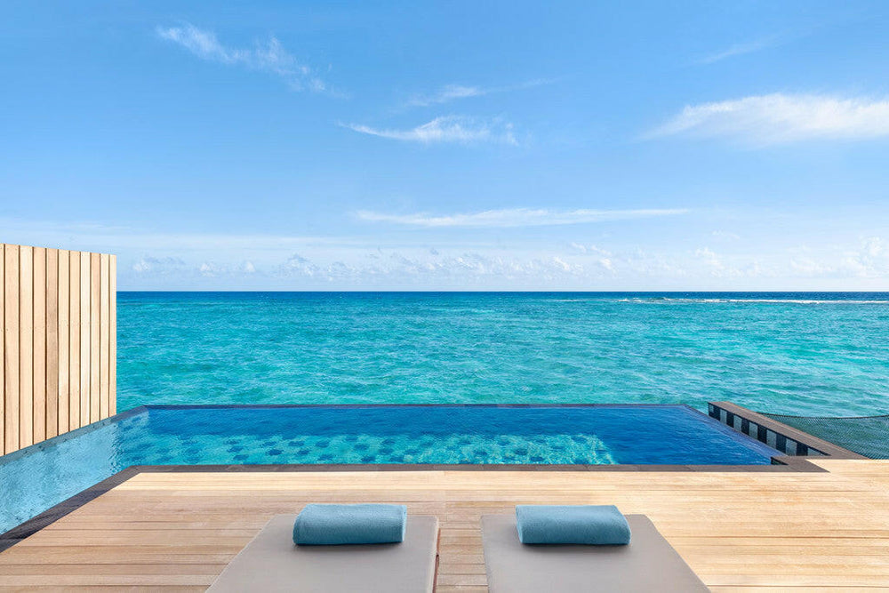 Hilton Maldives Amingiri Resort & Spa, North Malé Atoll — overwater villa exterior