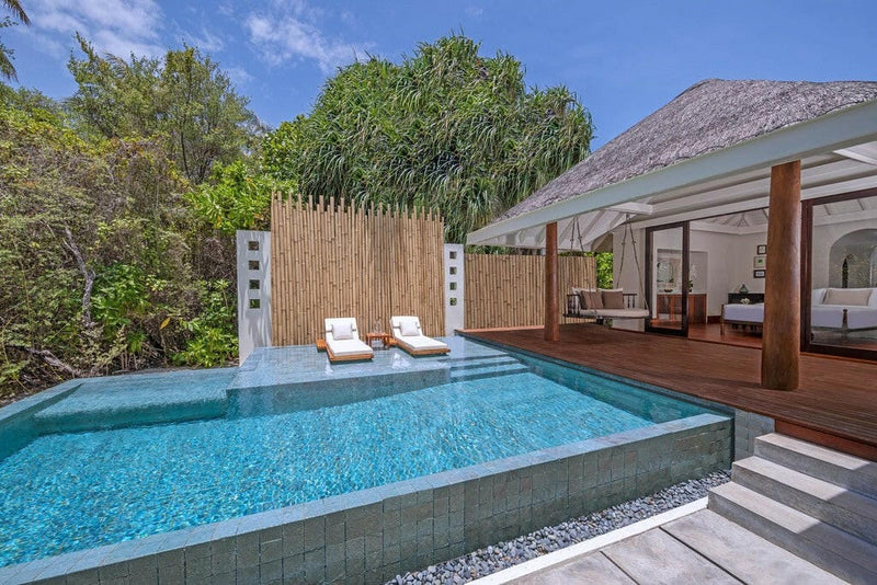 A Sunset Beach Pool Villa at Anantara Kihavah Maldives Villas, loungers on the deck beside the private pool